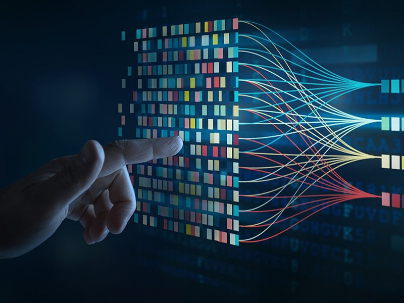 Representação gráfica de dados sendo processados, com uma mão interagindo com uma rede de conexões e fluxos de informações, simbolizando o conceito de inteligência de dados e Big Data. A imagem destaca a complexidade e interconectividade dos dados no ambiente digital.